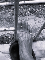 Worship my convict feet, see my feet behind prison bars  cover image